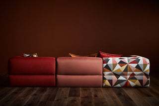 Puffalo Lounge modular seating in red, brown, and patterned fabrics.