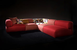 Red sectional sofa with geometric cushions